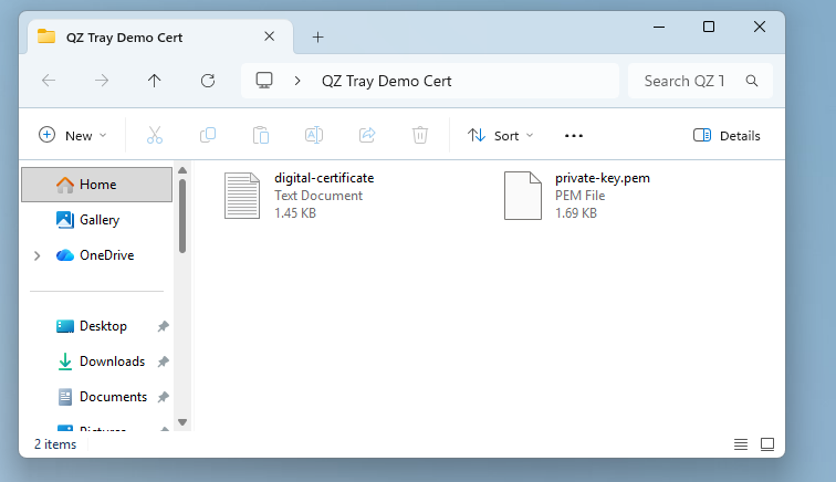 The digital-certificate.txt and private-key.pem files inside the QZ Tray folder